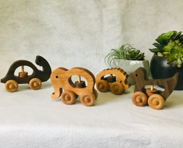 Handcrafted wooden toy rattles in Elephant, Hedgehog, Duck, and Turtle designs, perfect for engaging and entertaining little ones.