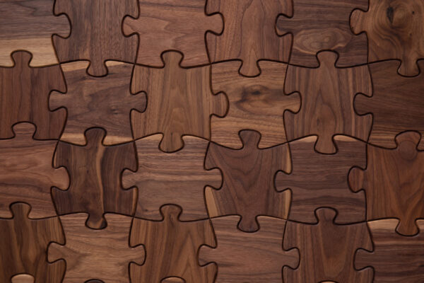 Wooden puzzle piece wall coverings from the Enigma collection by Jamie Beckwith, available at Fraser Wood Elements in Fredericksburg, VA.