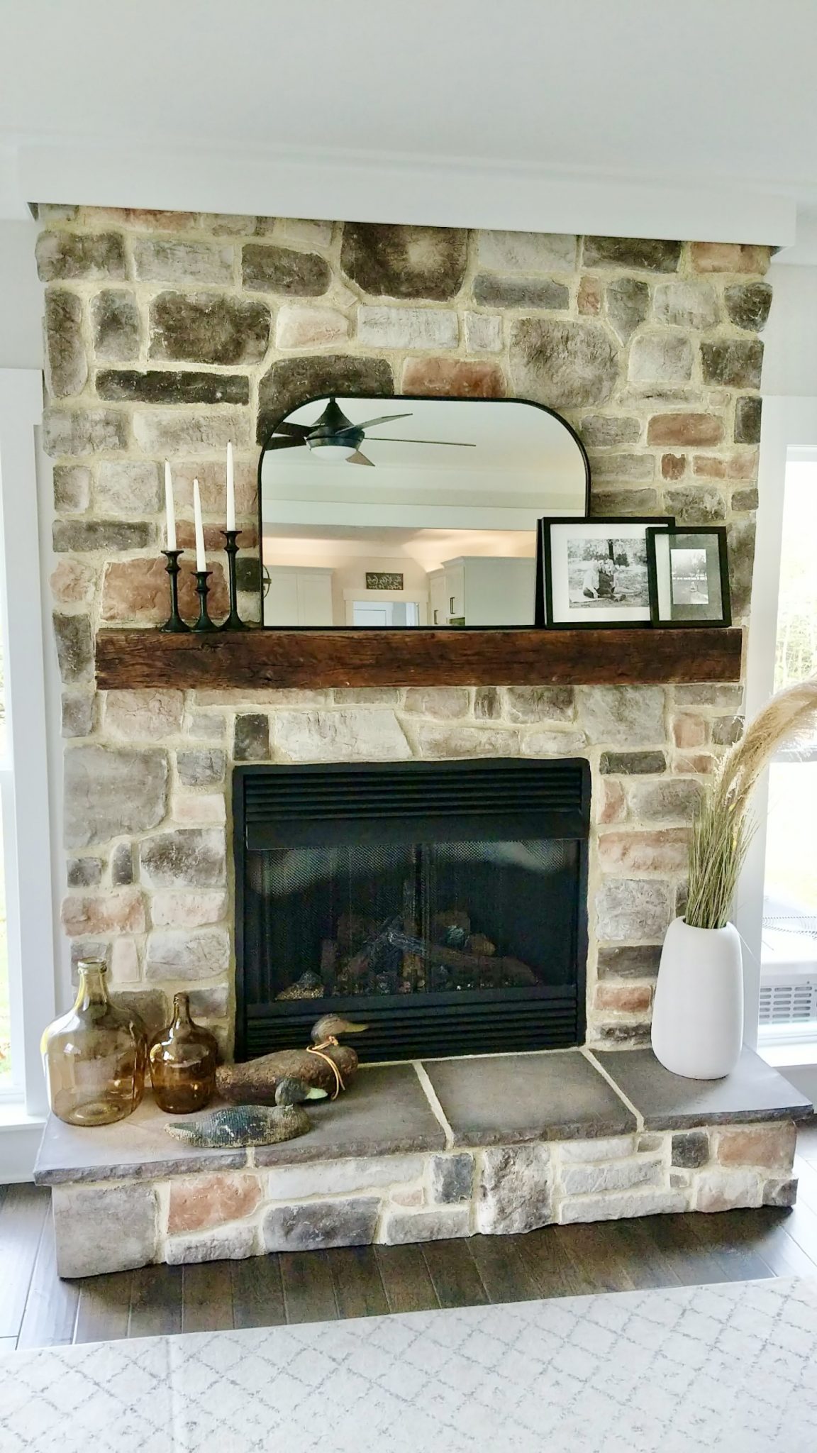 An example of a custom mantel installed in a living room by Fraser Wood Elements in Fredericksburg, VA.